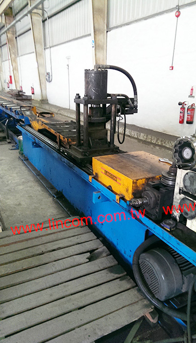 Flat bar chamfering, straightening and cutting equipment.