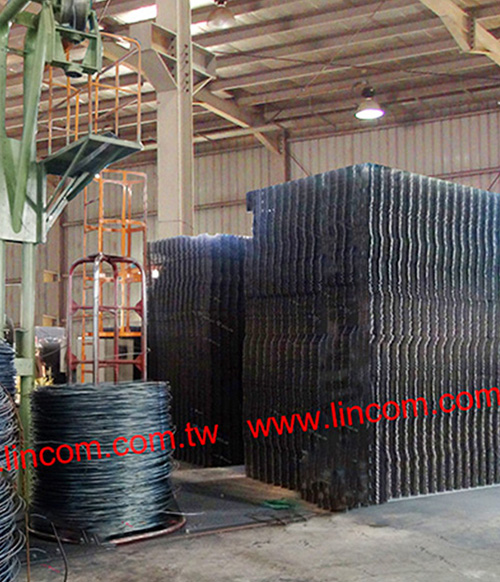 Rebar wire coiled in wire stands & finished welding type wire panels.